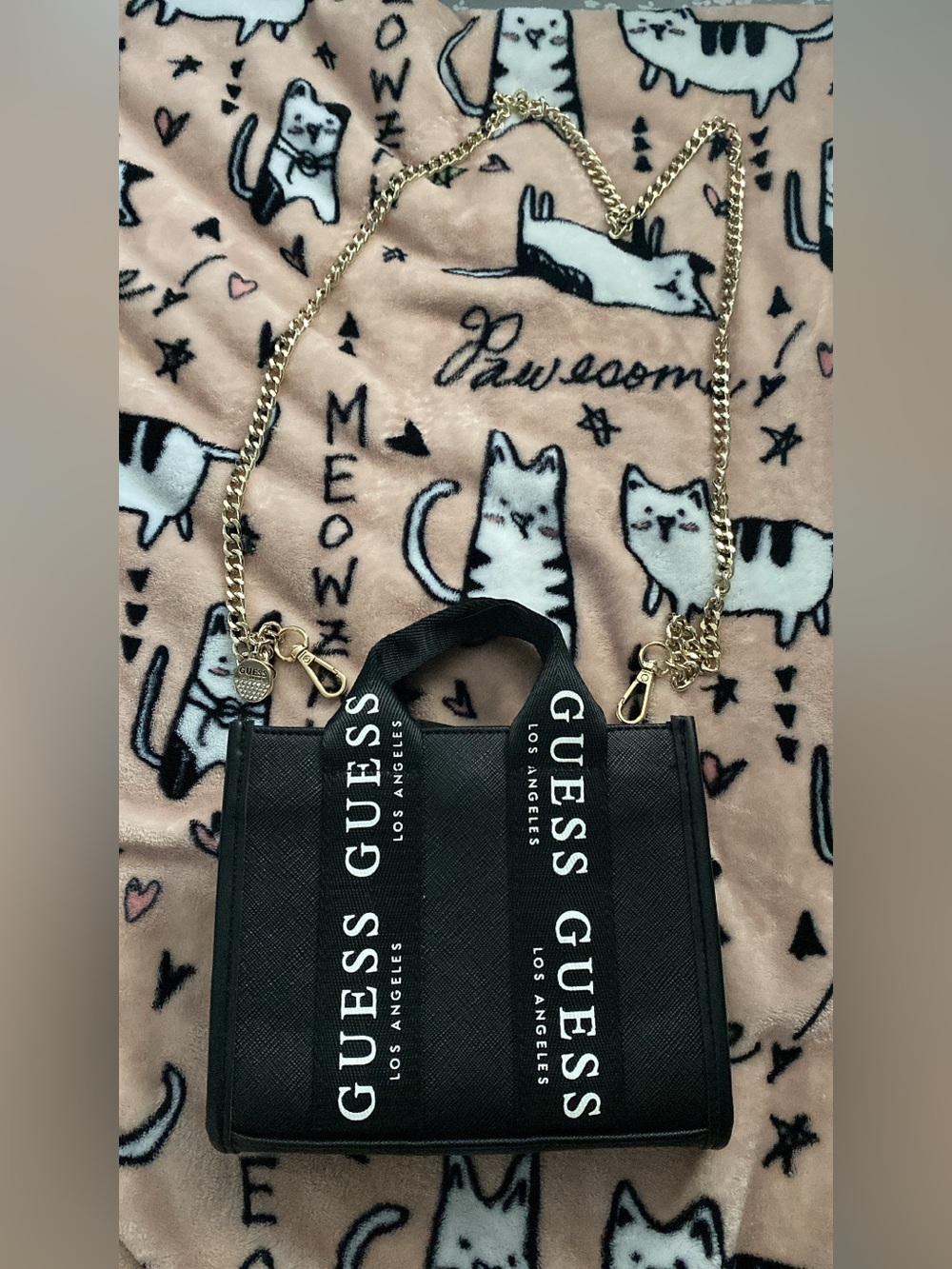 Guess mini crossbody with gold hardware.